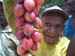 man with tamarillos