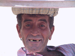Man on beach no teeth