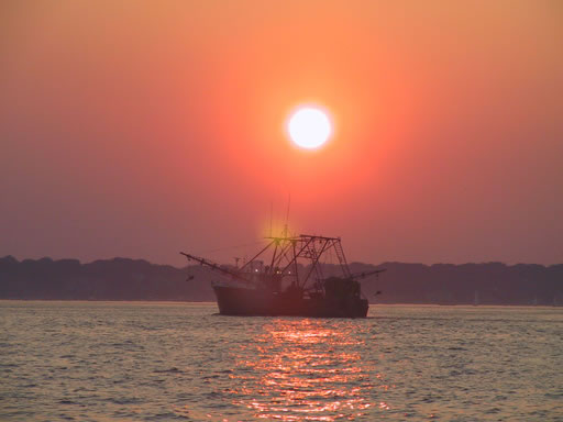 Fishing boat at sunset